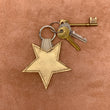 Load image into Gallery viewer, Leather star kering in gold.