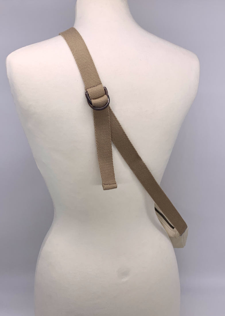 back of mannequin showing adjustable strap of leather crossbody bag