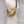 Load image into Gallery viewer, Small crossbody bag in gold leather worn across a mannequin
