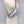 Load image into Gallery viewer, Small crossbody bag in silver leather worn across a mannequin
