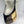 Load image into Gallery viewer, Crossbody panelled leather bag comprising matte black, antique gold and gold worn across mannequin
