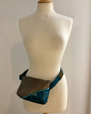 Split Front Soft Leather Belt Bag  in teal and bronze on a mannequin