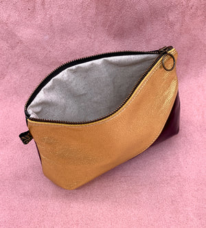 Split leather wash bag open in gold and black