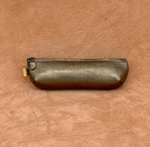 Soft leather pencil ase in antique gold.