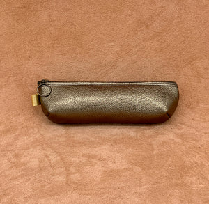Soft leather pencil ase in antique gold.