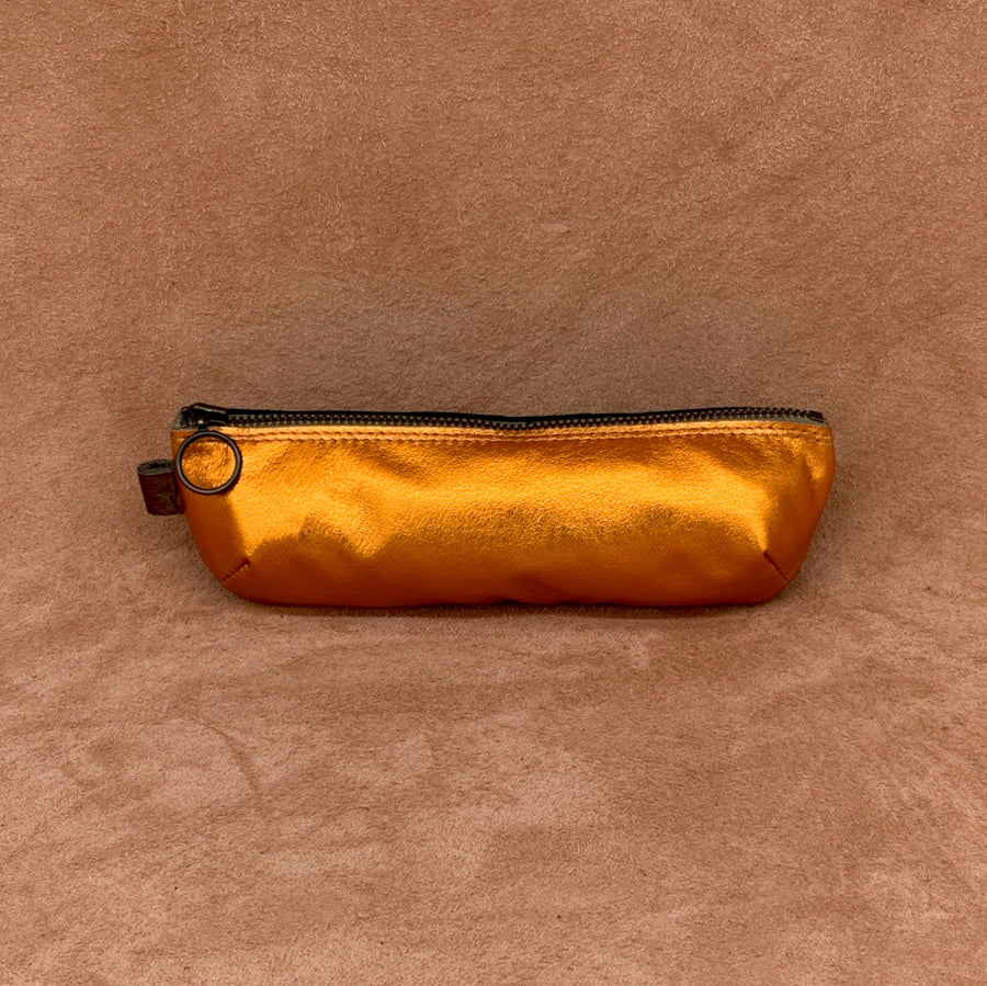Soft leather pencil ase in electric orange.