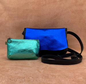 Soft leather purse in electric turquoise and a larger bag in blue.